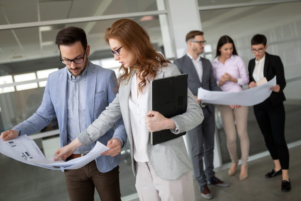 Creative business people working on business project in office